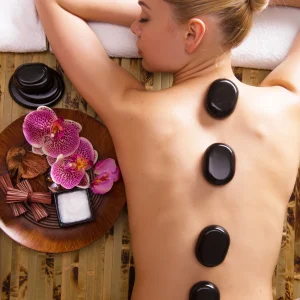 beautiful-woman-relaxing-spa-salon-with-hot-stones-body-beauty-treatment-therapy
